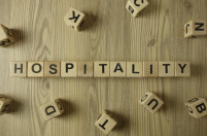 Hospitality spelled out in Scrabble tiles