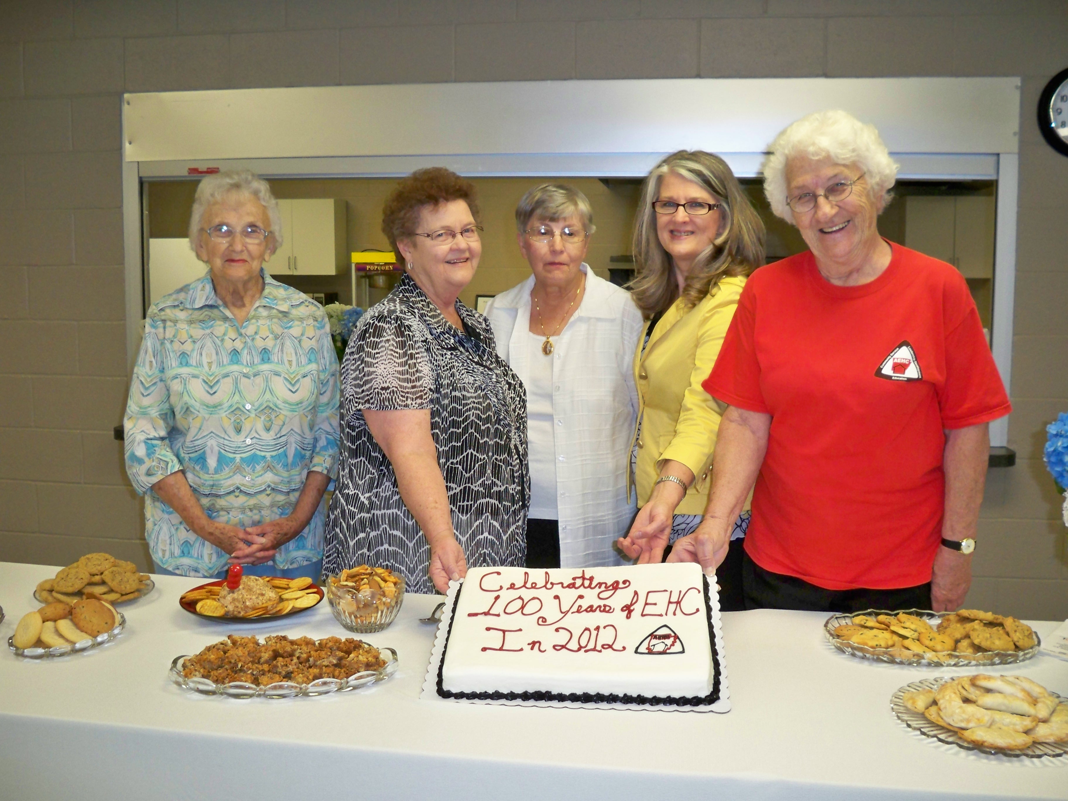 Clay County Extension Homemakers 100th Anniversary celebration showing cake.