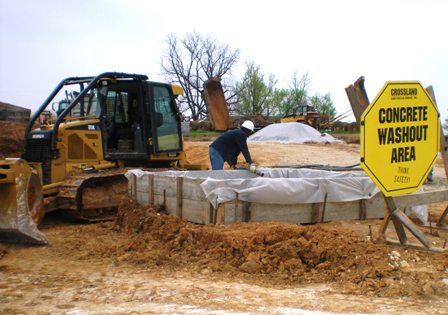 construction site with sign concrete washout area