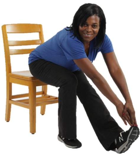 woman sitting in a chair stretching her leg
