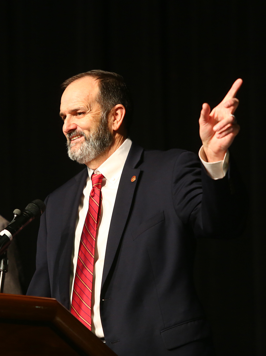 Bob Scott smiling at the lectern after receiving an award