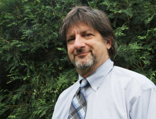 Stephen Carpenter, attorney, wearing a dress shirt and a tie.