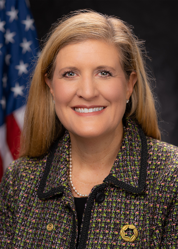 Alexandra Dunn portrait with flag in background