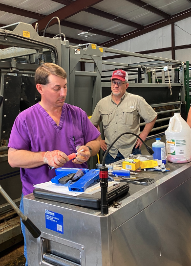 BQA workshop image showing a veterinarian and county agent. 