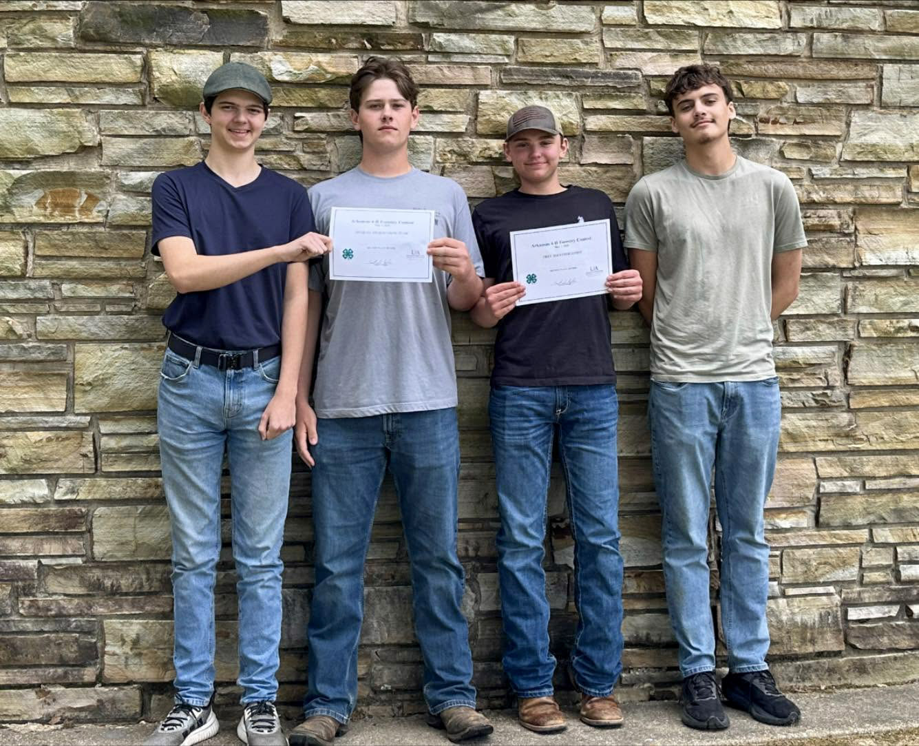 Four of the five members of the Baxter County 4-H forestry team