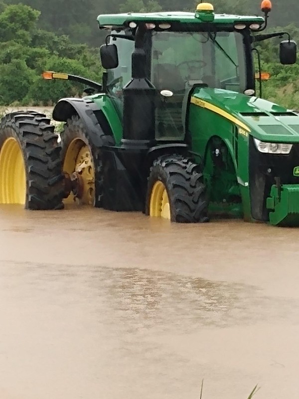 Tractor in floodwaters