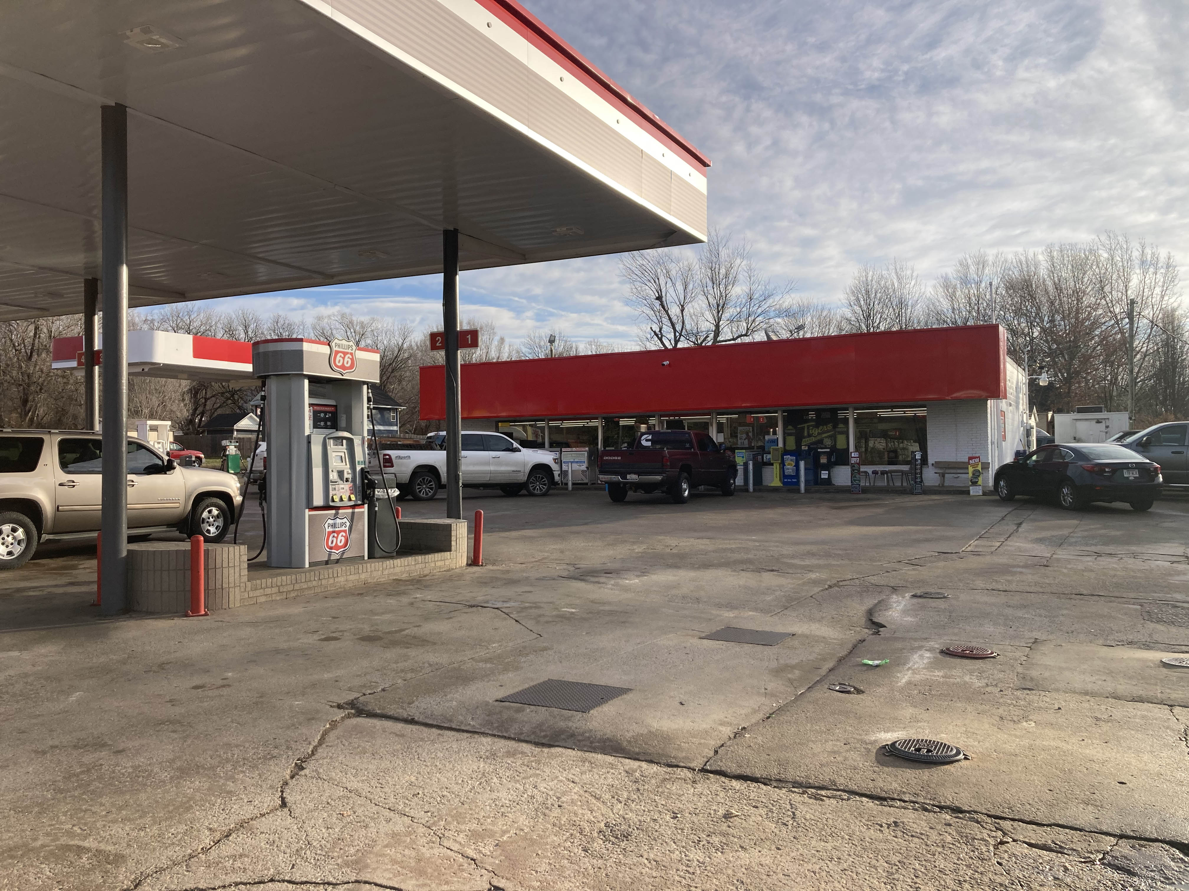 Trucks parked outside a gas station diner