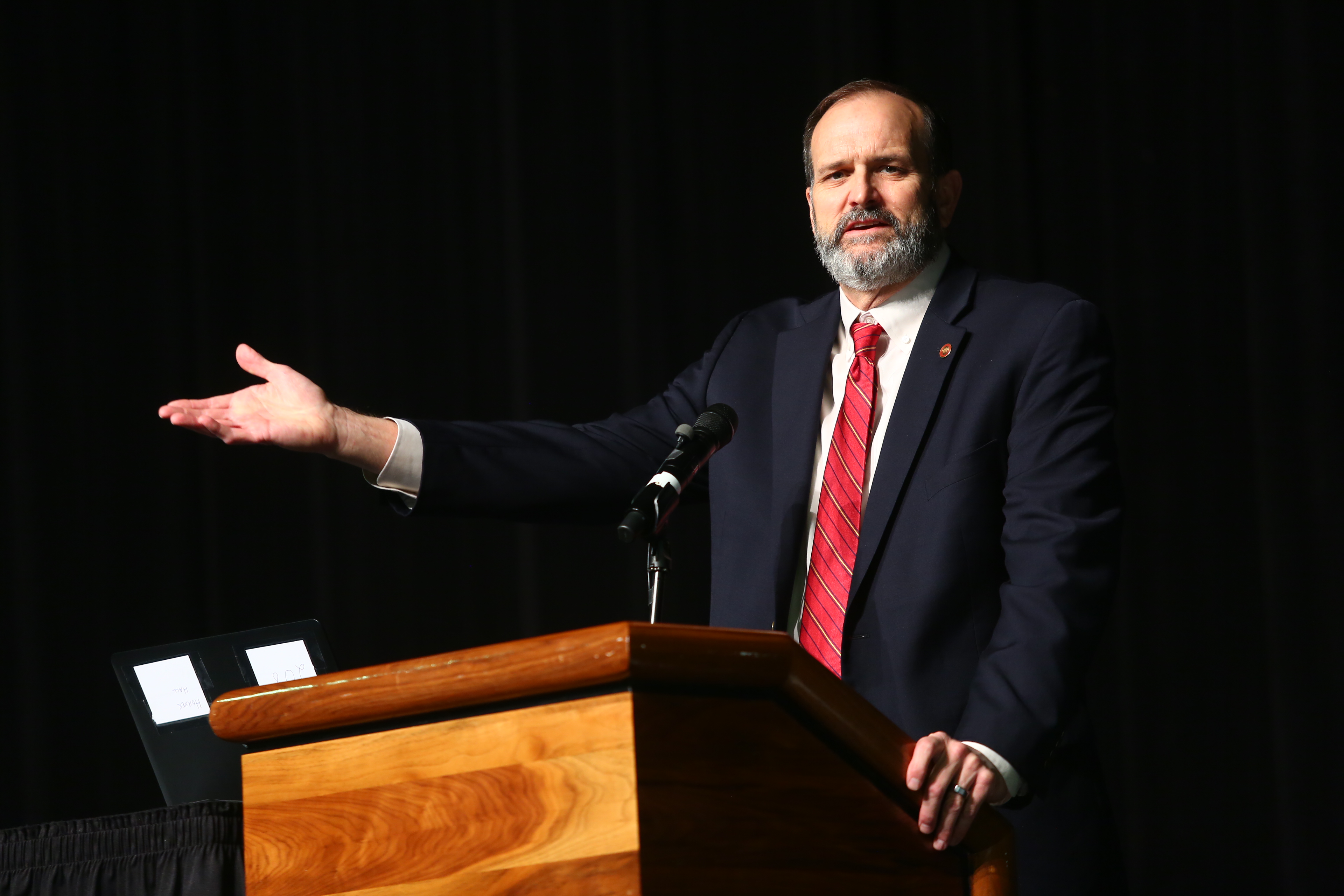 Bob Scott speaking at podium.