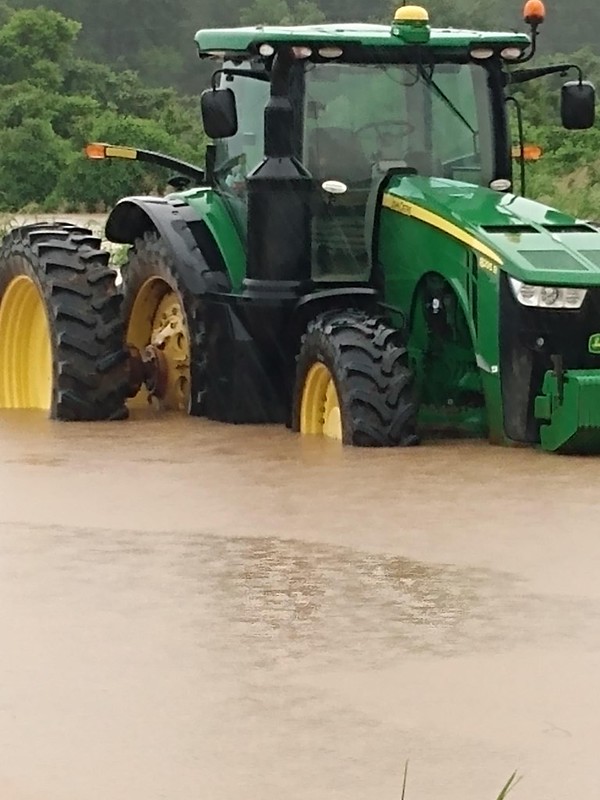 Tractor in flood water Tractor in flood water