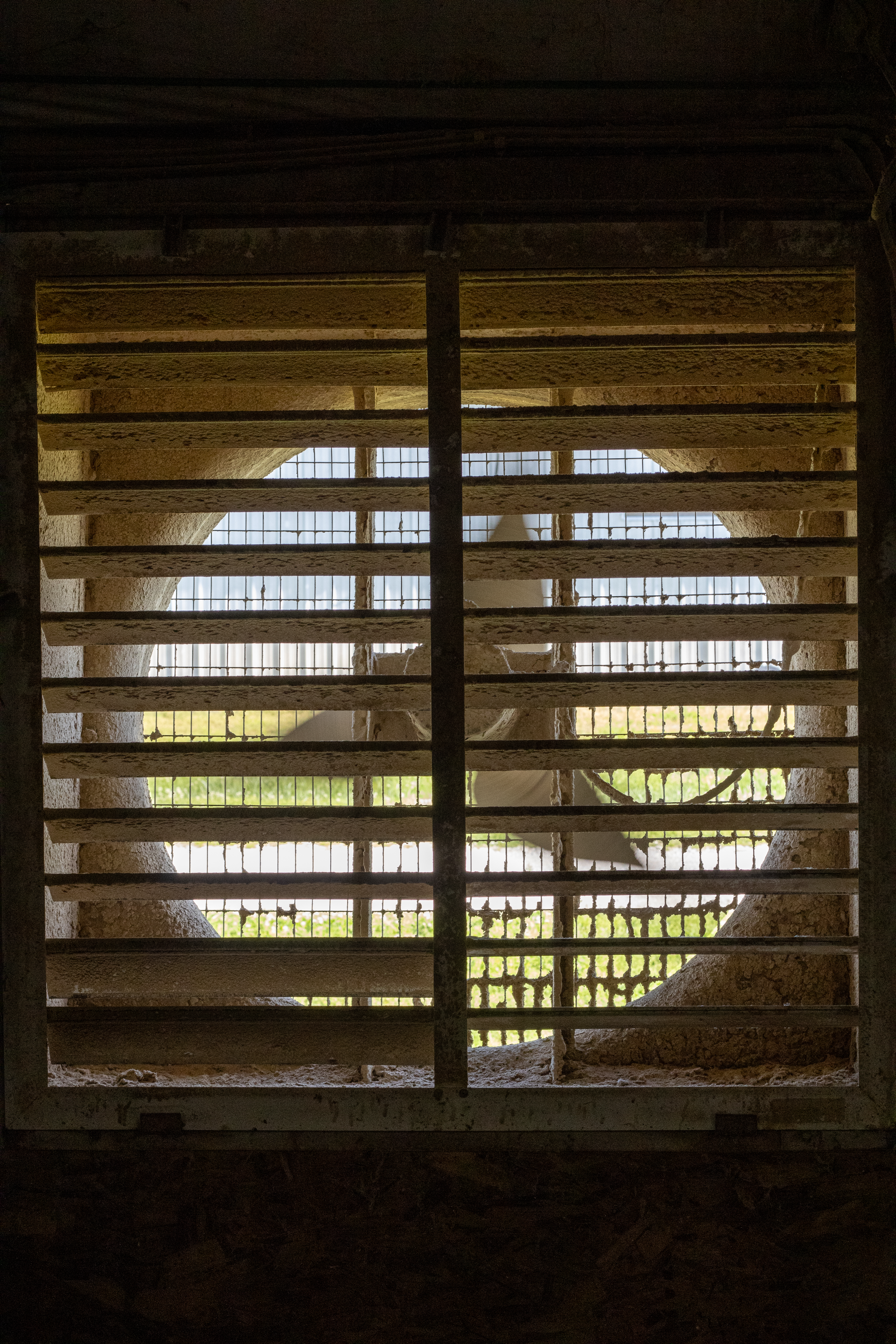 Dirty exhaust fan inside poultry house.