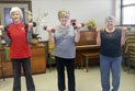 Group of ladies working out with weights