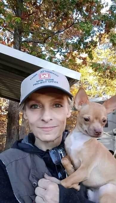 Park attendant Rhonda Hernandez with one of her three dogs that share her park attending duties.