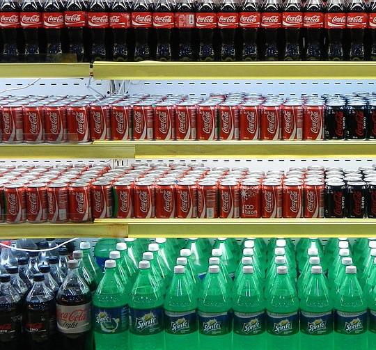 Image of soft drink bottle on display in a grocery store