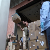 Unloading the PPE upon arrival in Arkansas