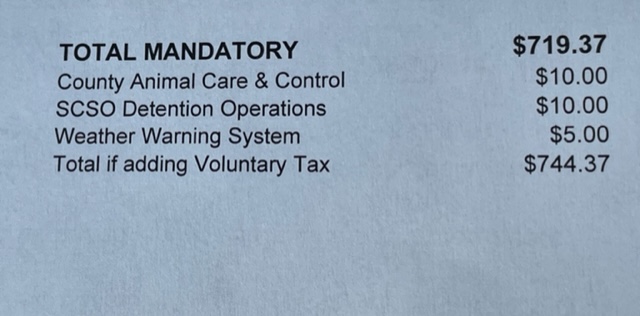 close up of Arkansas property tax bill showing voluntary taxes owed in Saline County