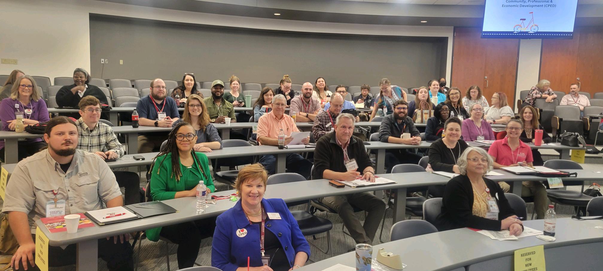 Picture of new employee orientation participants in auditorium 