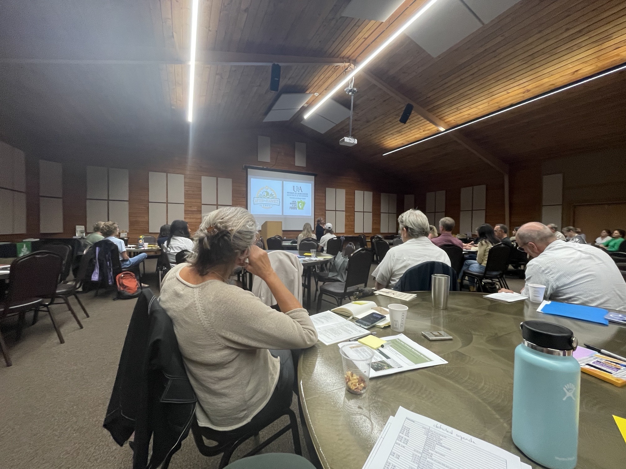 Attendees of After the Harvest listening to a speaker. 