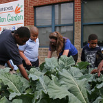 Laura Warren, Pulaski County extension program associate for the University of Arkansas System Division of Agriculture, explains to a third-grade class the nutrition value of one of the crops in the MLK Elementary School Nutrition Garden. 