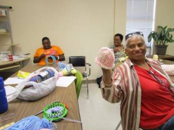 Extension Homemakers ladies making preemie caps for Ark. Children's Hospital