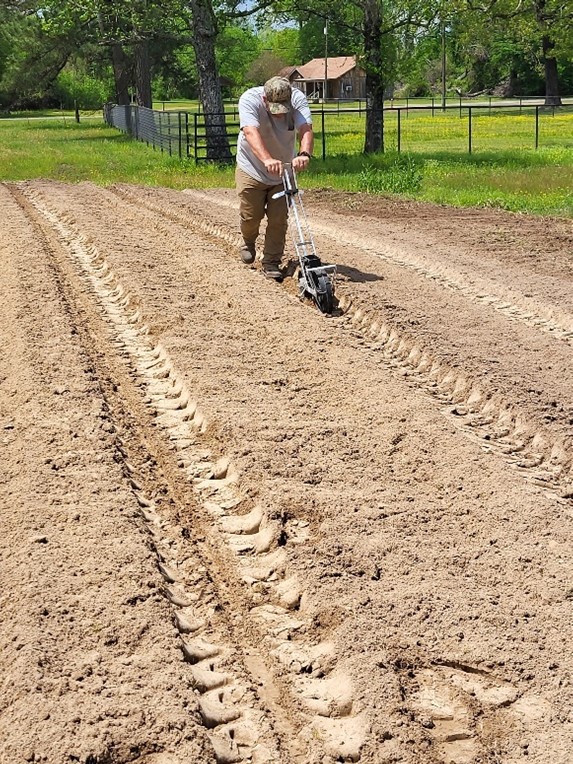 man plowing field