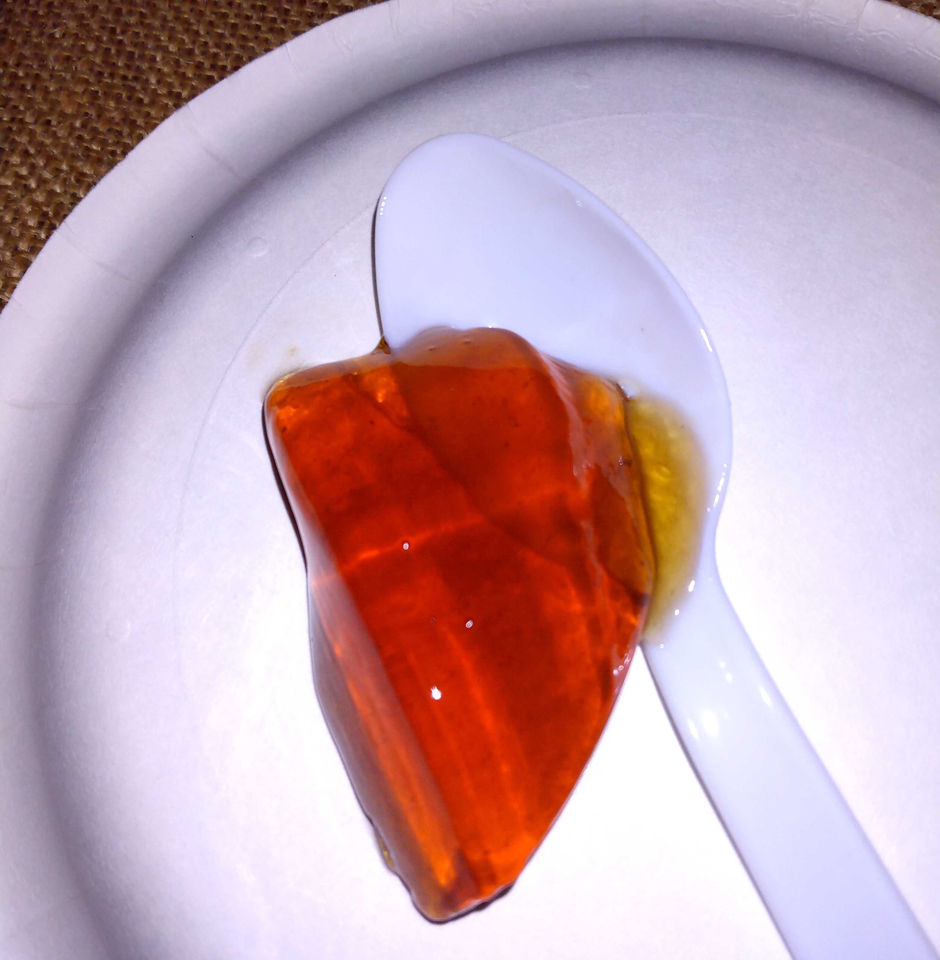 homemade muscadine jelly spoon with a blob of homeade jelly on it