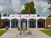 Clay County Courthouse - single level buildingl with white roof