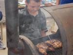 Boy grilling chicken in the BBQ contest