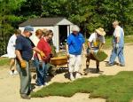 Garland County Master Gardeners laying sod for Habitat for Humanity