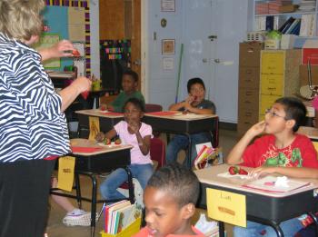 Agent teaching students in classroom about the SNAP program in Mineral Springs Arkansas