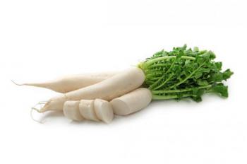 long white Daikon radishes with one partially sliced