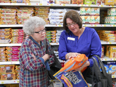 Miller County, Arkansas Interim Staff Chair Carla Hadley teaches client how to read food labels to make healthier, more cost effective choices