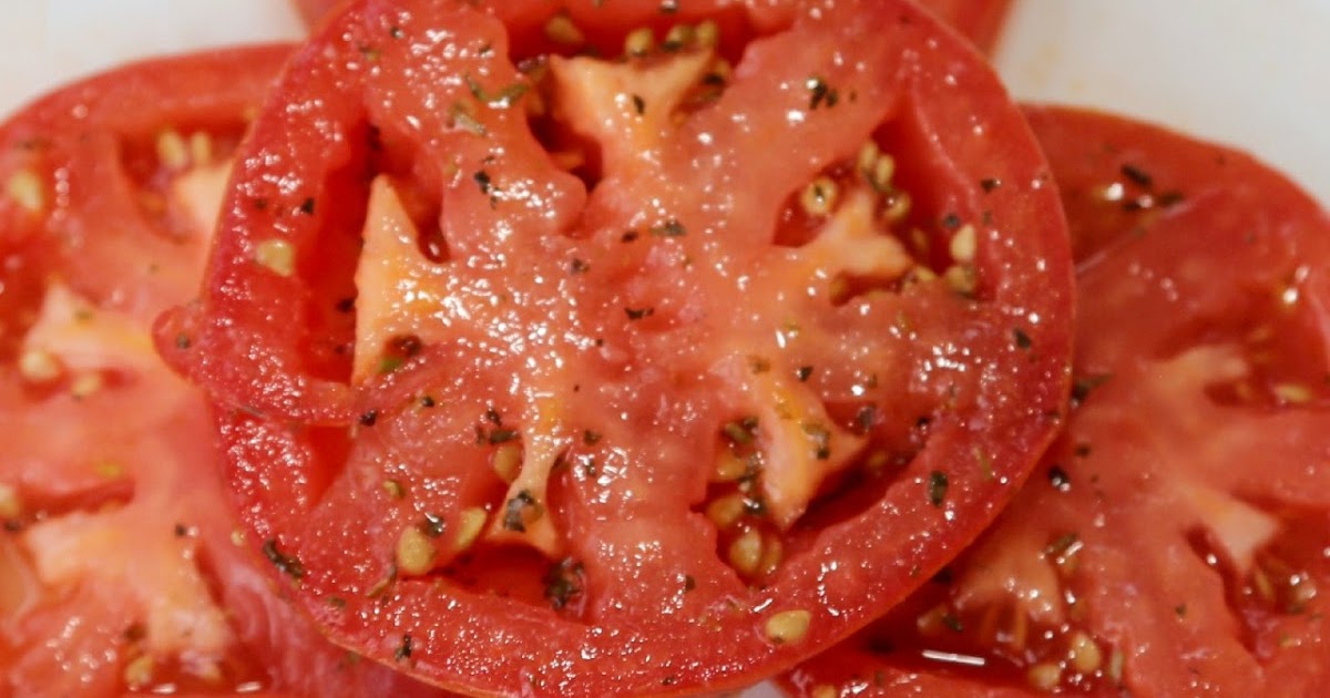 sliced tomatoes with marinade on it.