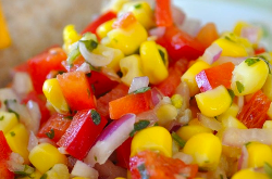 Corn and tomato salad with onions close up of corn and tomato salad