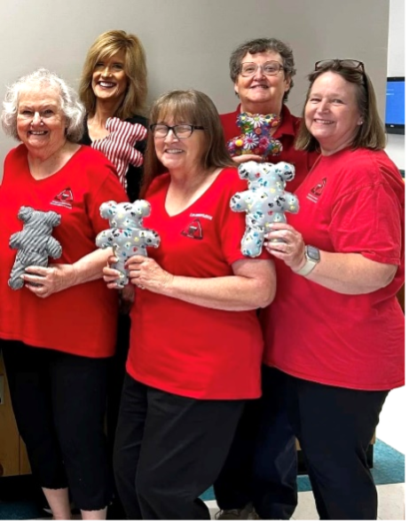 Photo: Members of the Central Community Extension Homemakers Club donate "shot dolls" to the Harrisburg Health Department.