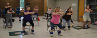 Photo of women and men in a fitness class