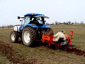 working on tractor in field