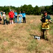 Wildlife biologist talking about prescribed burn to youth audience