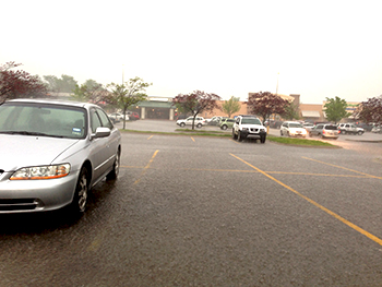 Intense rain on parking lot