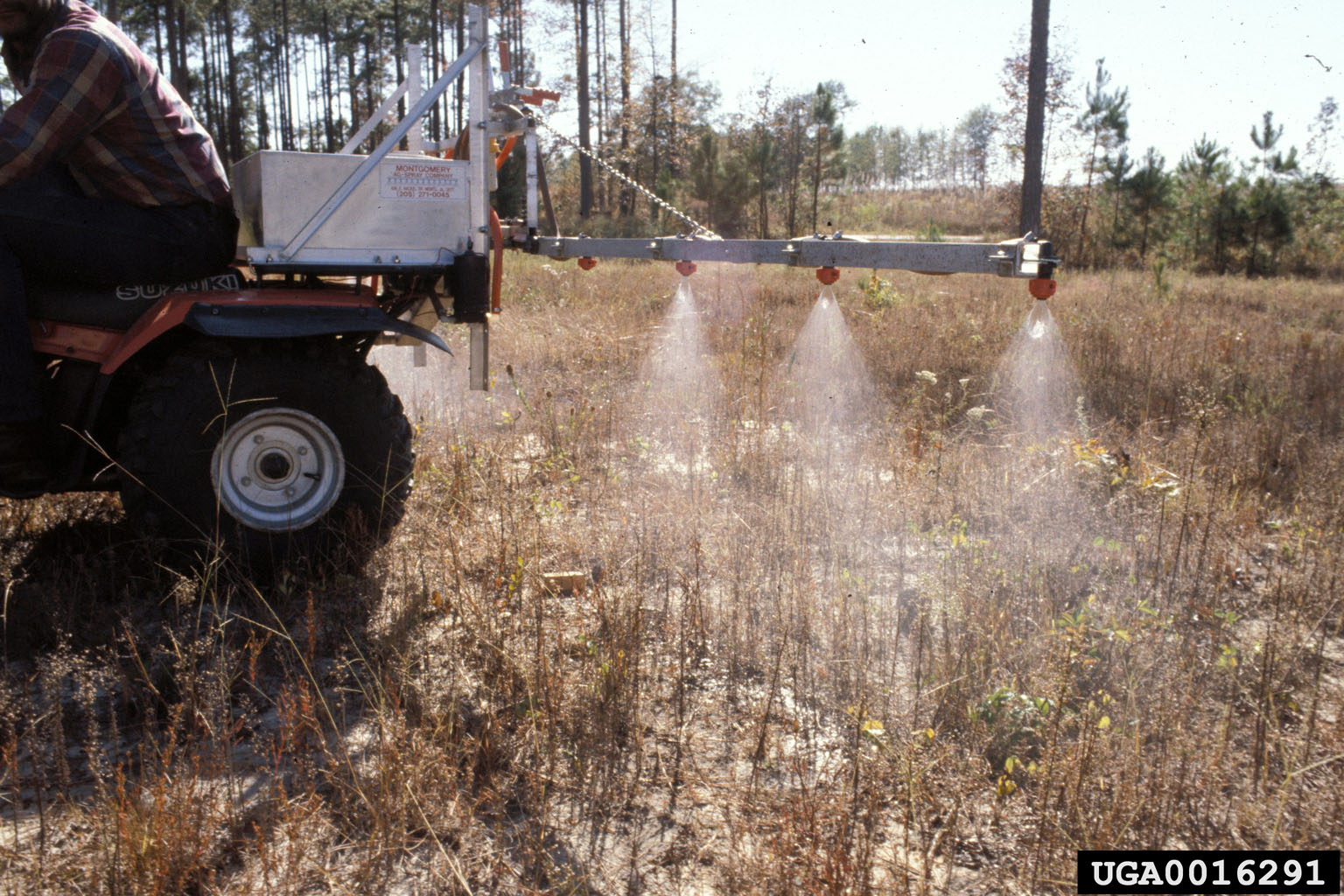 image of a 4-wheeler applying herbicide on a tree planting site