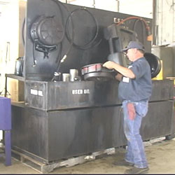 worker peoperly disposing of vehicle fluids