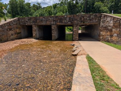creek under rock bridge