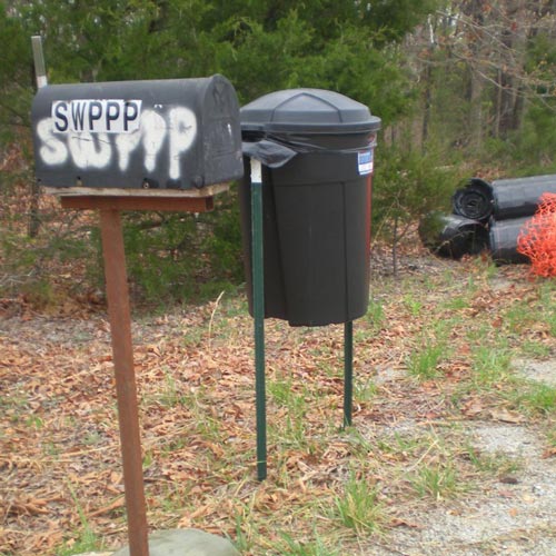 trash can on stilts to keep it from getting knocked over on construction site