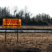 Duck lease sign in wet field