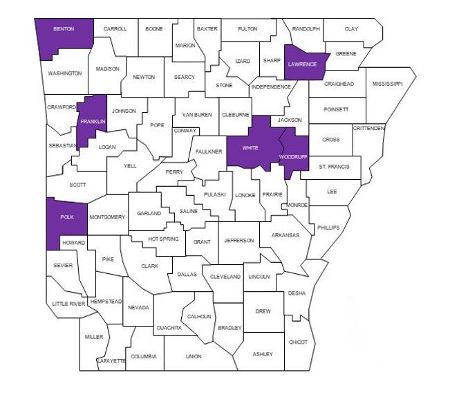 Photo of Arkansas map with counties outlined and several counties highlighted in purple