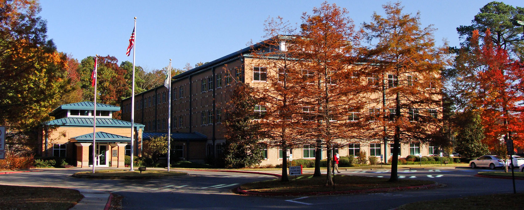 Arkansas Extension State office headquarters in Little Rock is a 3 story brick building with a teal colored roof