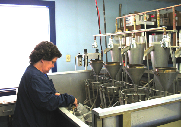Margie Miller runs the semi-automatic elutriator at the ANDL