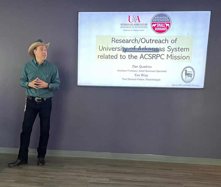 Man speaking in front of a presentation