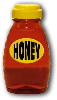Golden honey in a bottle with a yellow lid & a yellow label with Honey in black letters.