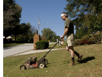 man mowing lawn