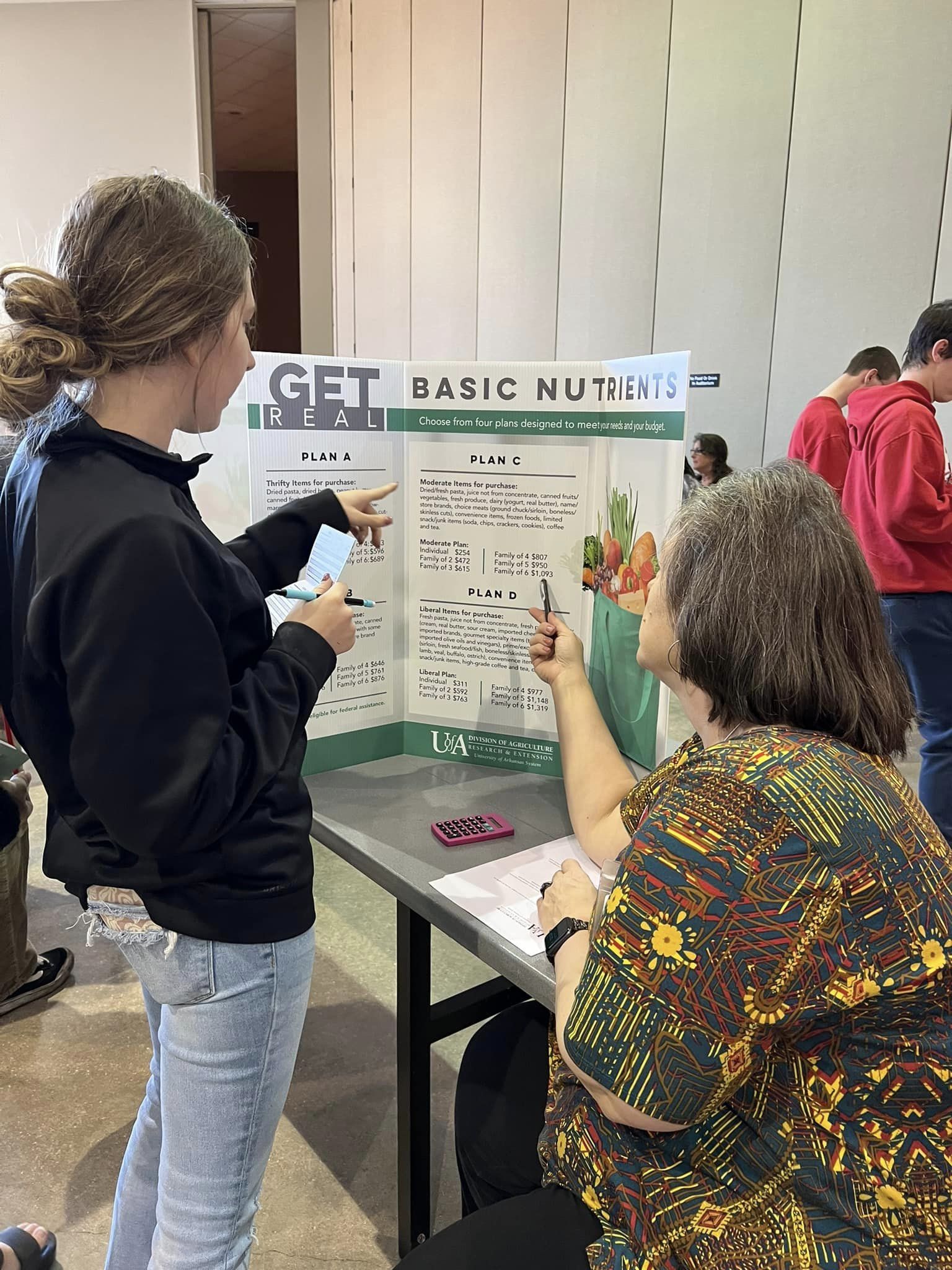 people looking at display of food